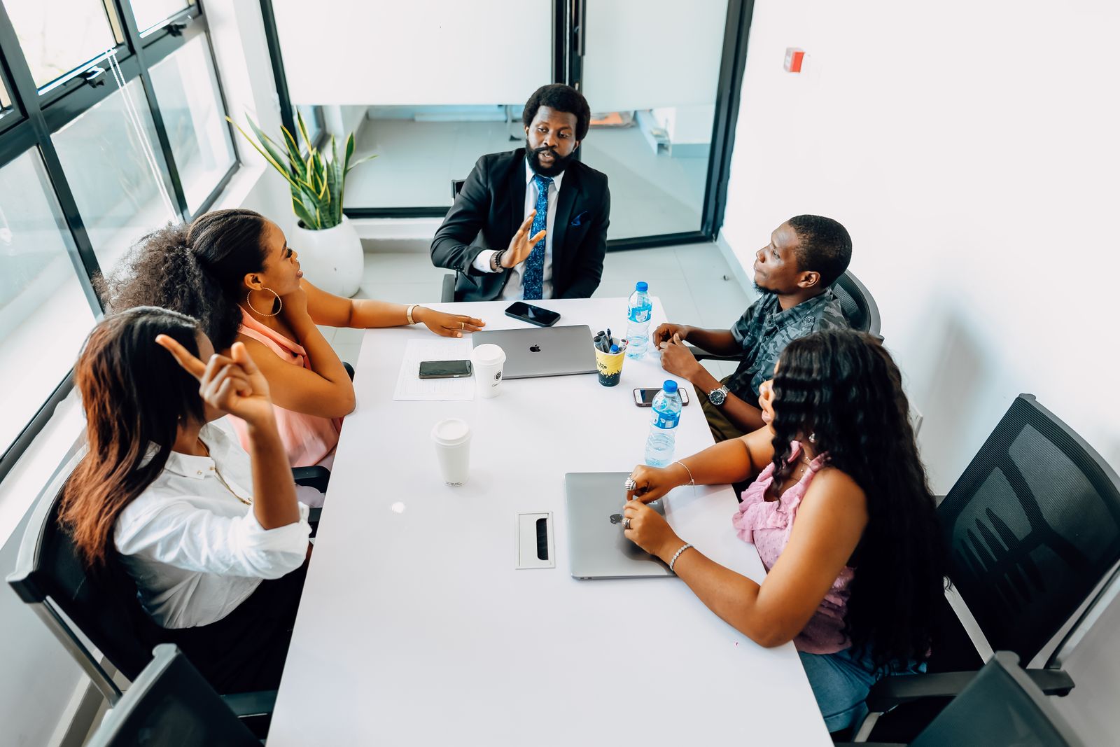 Business professionals in a collaborative meeting in a bright Lagos office