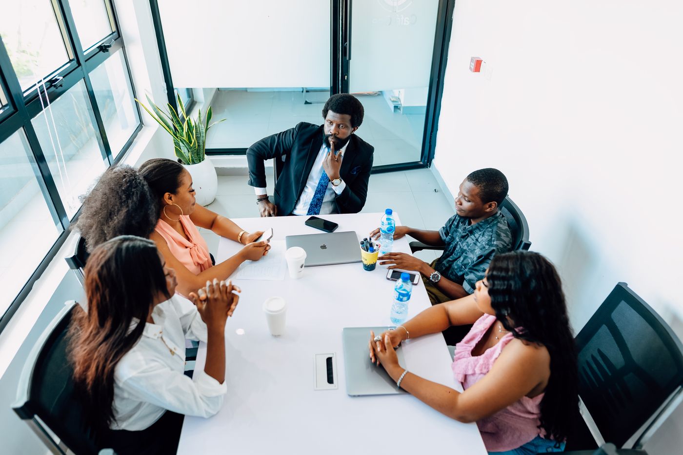 Team of professionals in a business discussion in a Lagos office